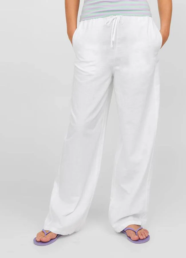 Pantalones fluidos de lino color blanco