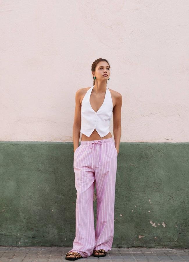 Pantalones fluidos de rayas rosa